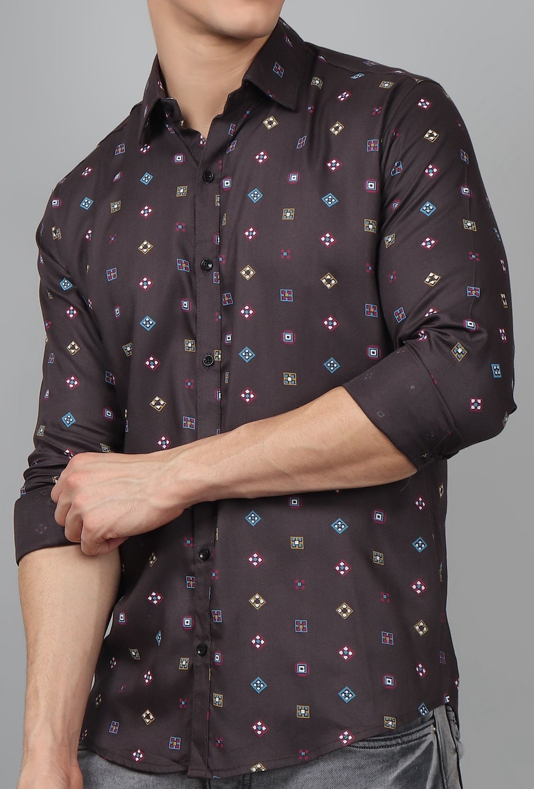 
a man wearing a black shirt with a pattern on it
