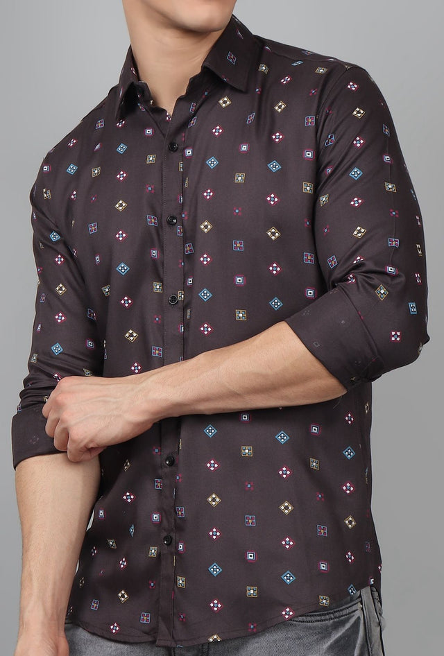 
a man wearing a black shirt with a pattern on it
