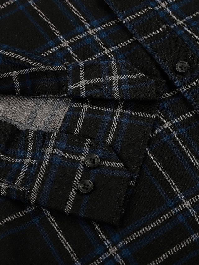 a close up of a black and blue plaid shirt