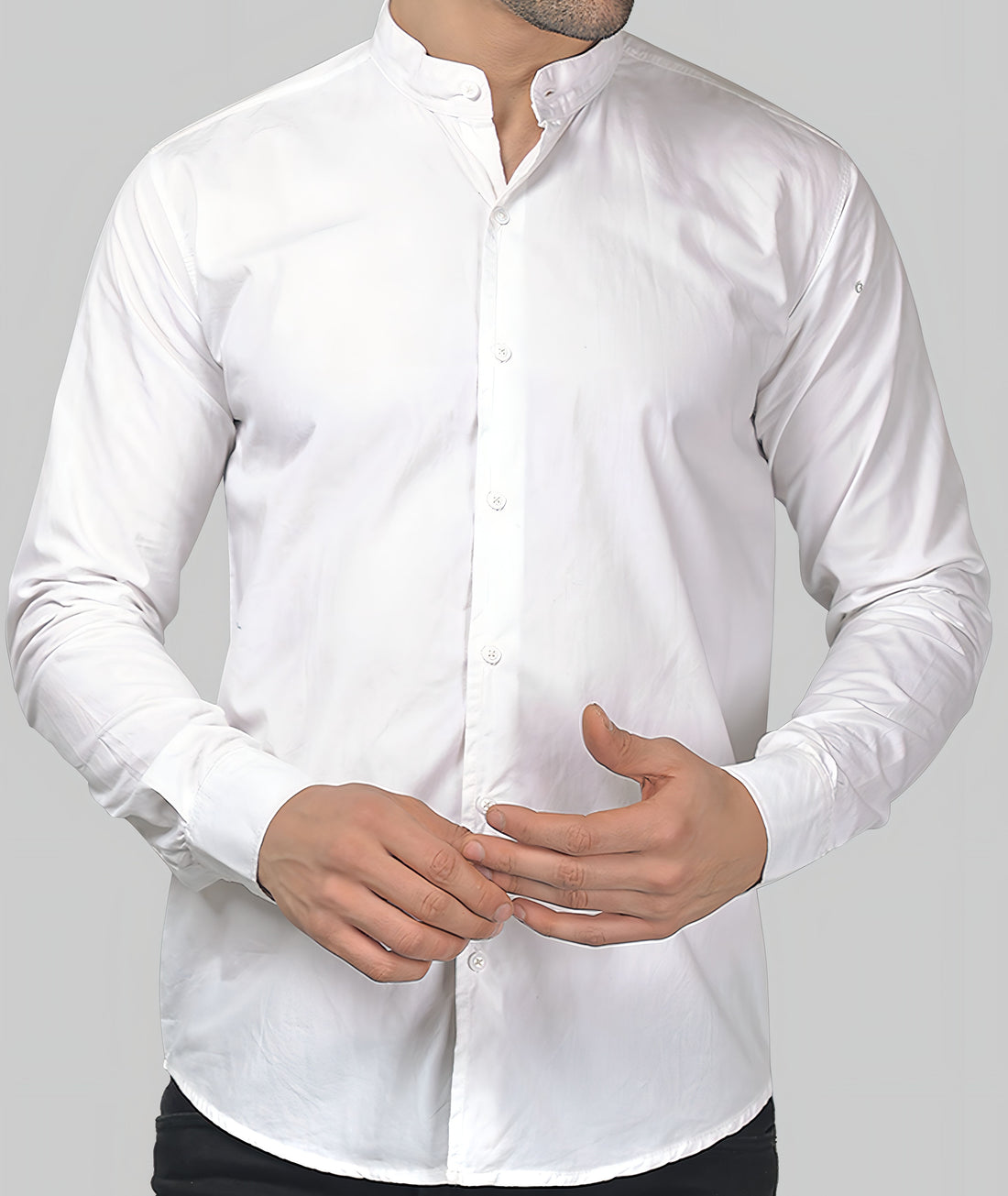 a man wearing a white shirt and black pants