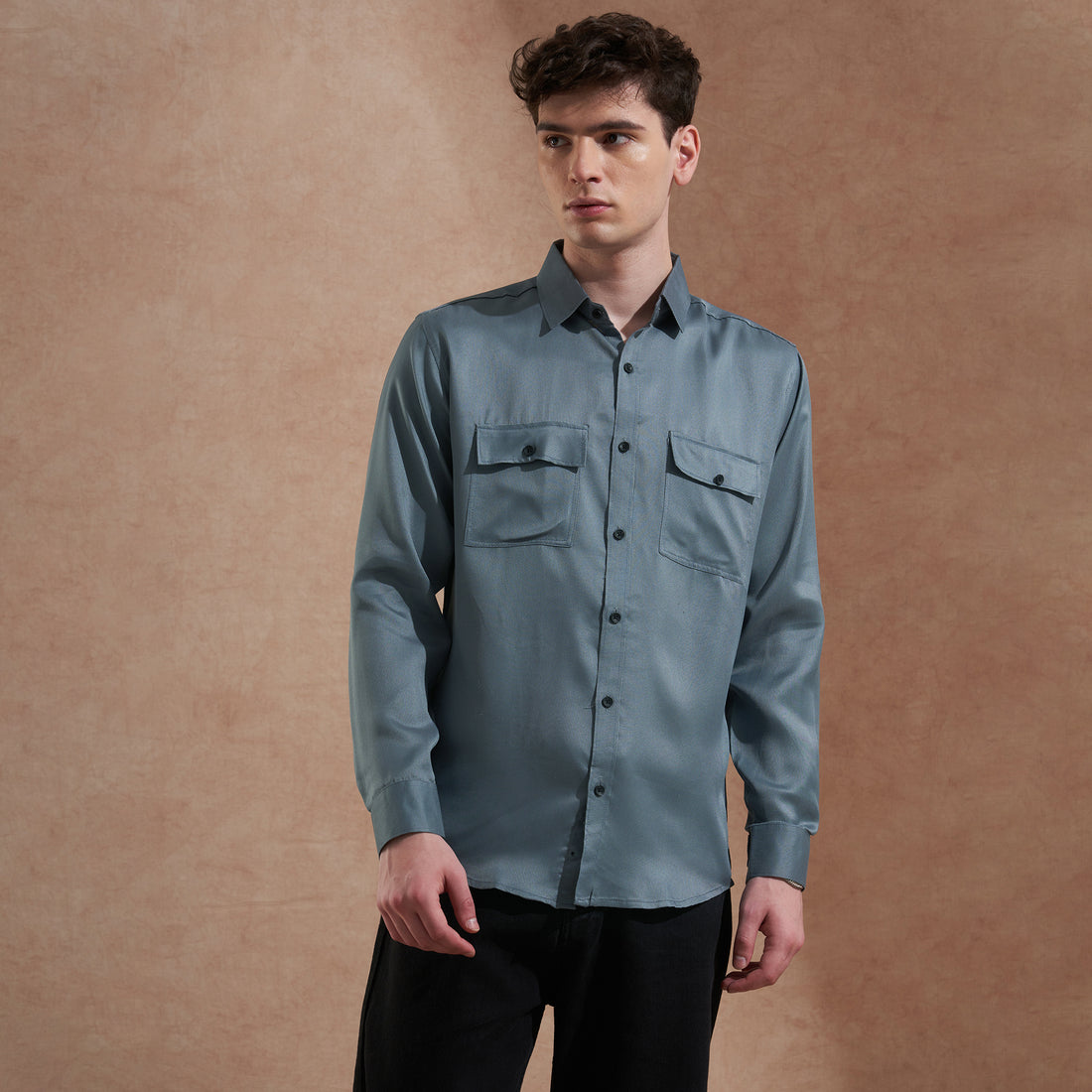 Men's blue solid slim-fit shirt with dual flap pockets, product view