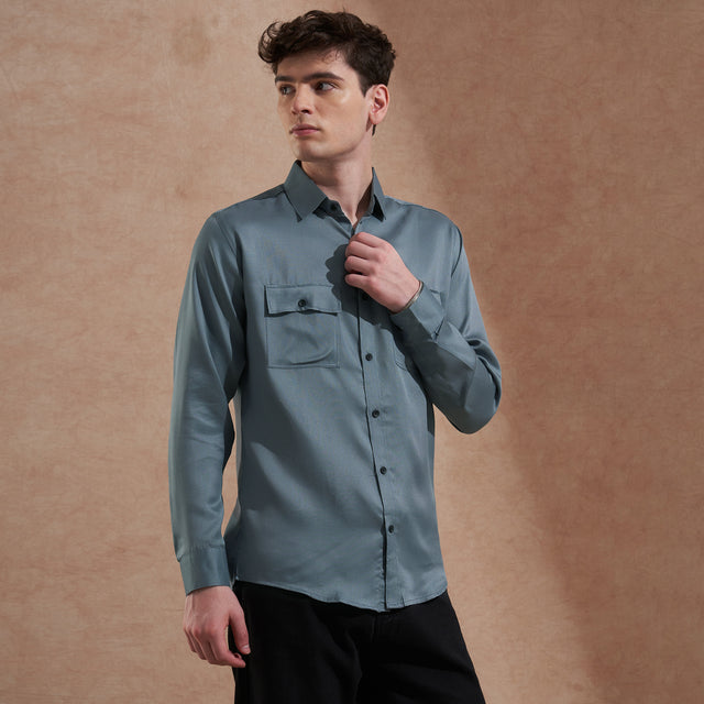 Men's blue solid slim-fit shirt with dual flap pockets, product view