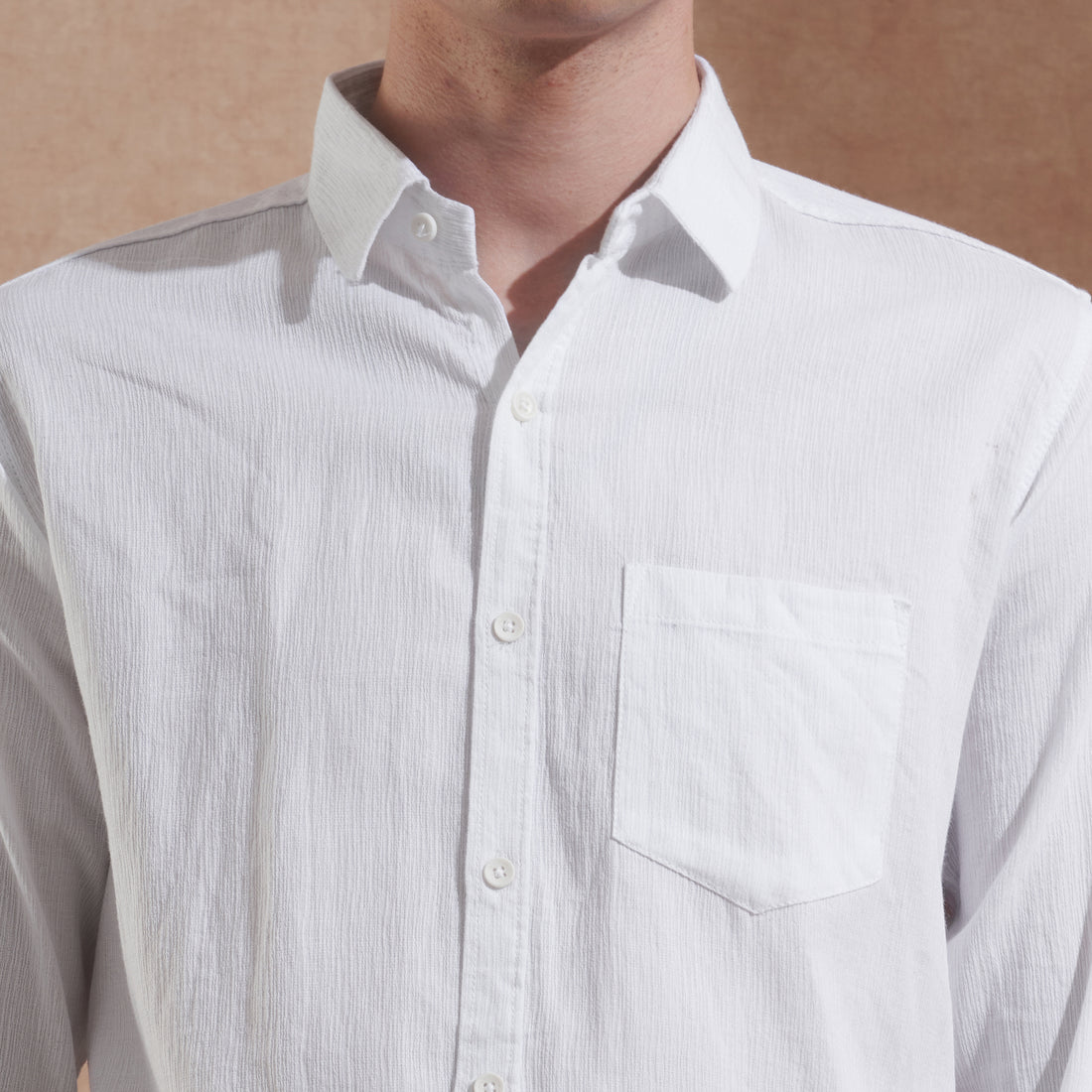 Men's white solid slim-fit shirt with spread collar, product view