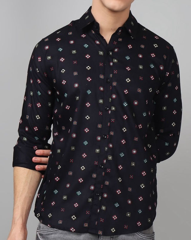 
a man wearing a black shirt with a pattern on it
