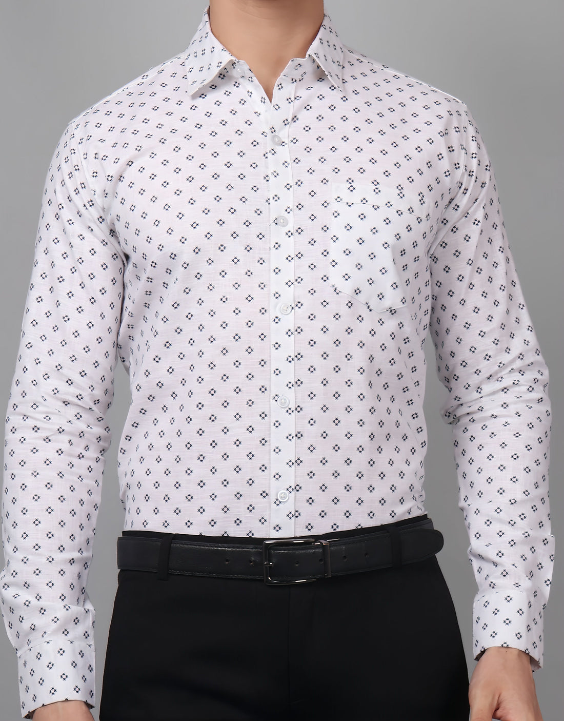 
a man wearing a white shirt and black pants
