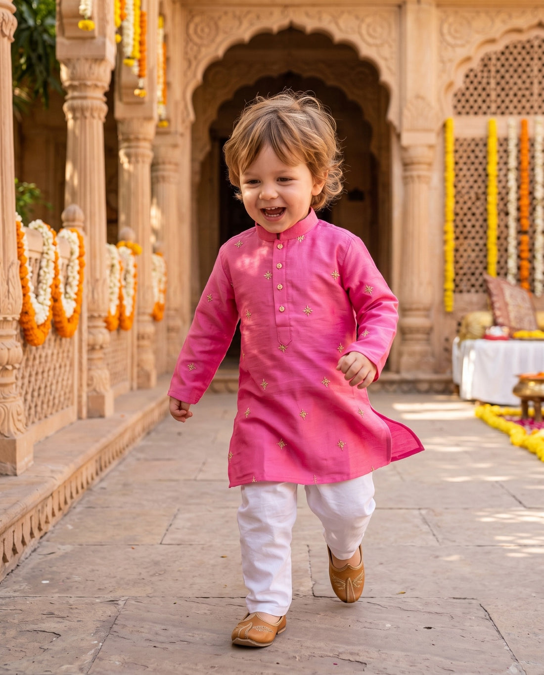 TryBuy magenta embroidered boys kurta, 2–3 years, walking view in a festive haveli setting