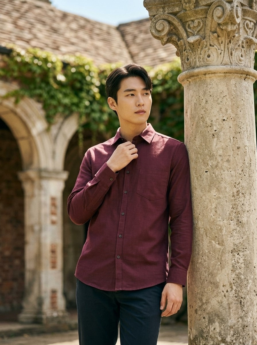 TRYBUY.IN TB_21190 burgundy cotton-linen men's shirt, courtyard lifestyle view showing its solid colour, spread collar and chest pocket.