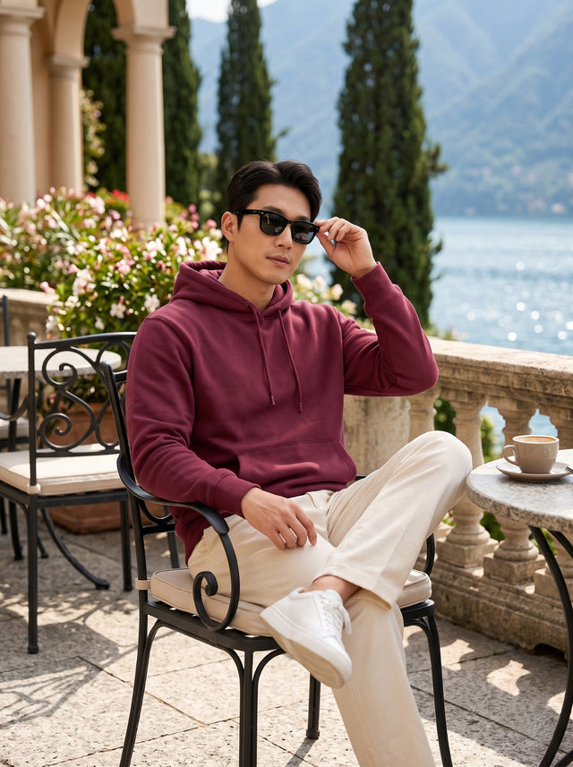 
Men's maroon cotton pullover hoodie, seated front lifestyle view
