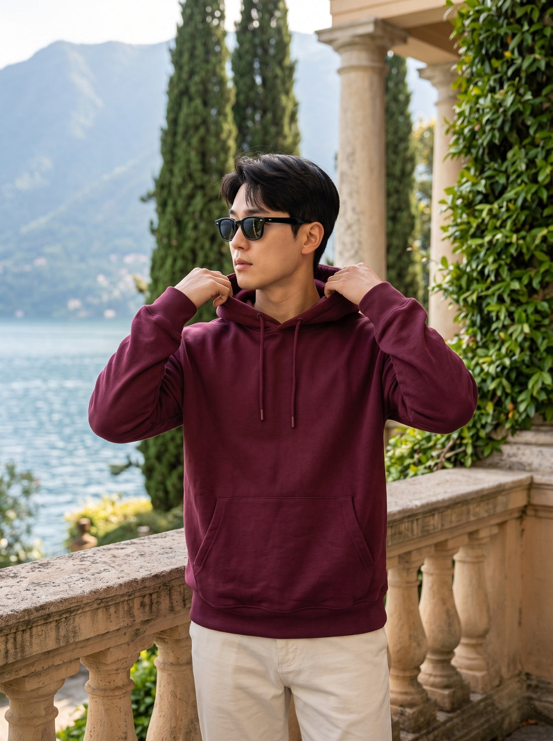
Men's maroon cotton pullover hoodie, front hood detail lifestyle view
