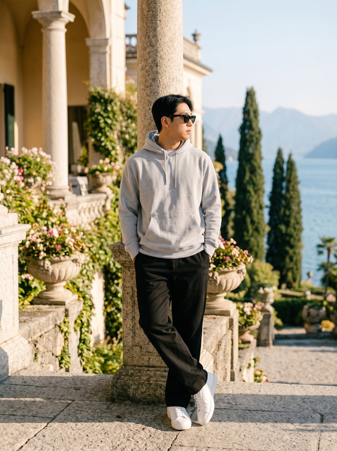 
Men's light grey cotton pullover hoodie, full-length leaning front view
