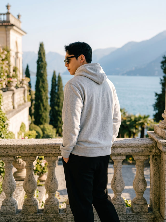 
Men's light grey cotton pullover hoodie, rear three-quarter view
