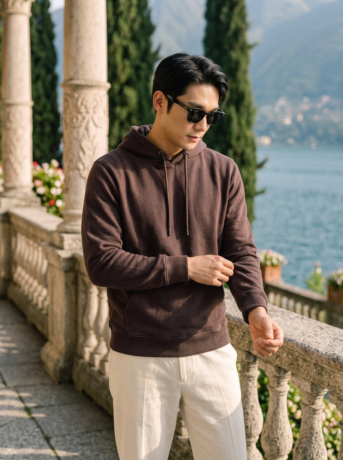 
Men's chocolate brown cotton pullover hoodie, front cuff detail lifestyle view
