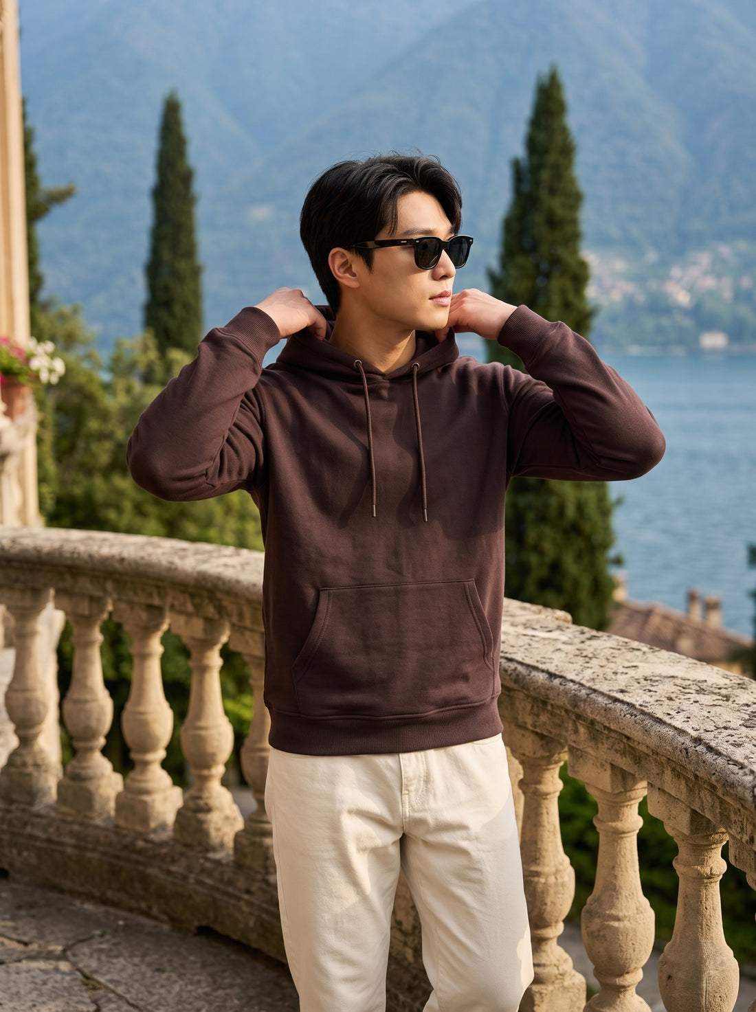 
Men's chocolate brown cotton pullover hoodie, front hood detail lifestyle view
