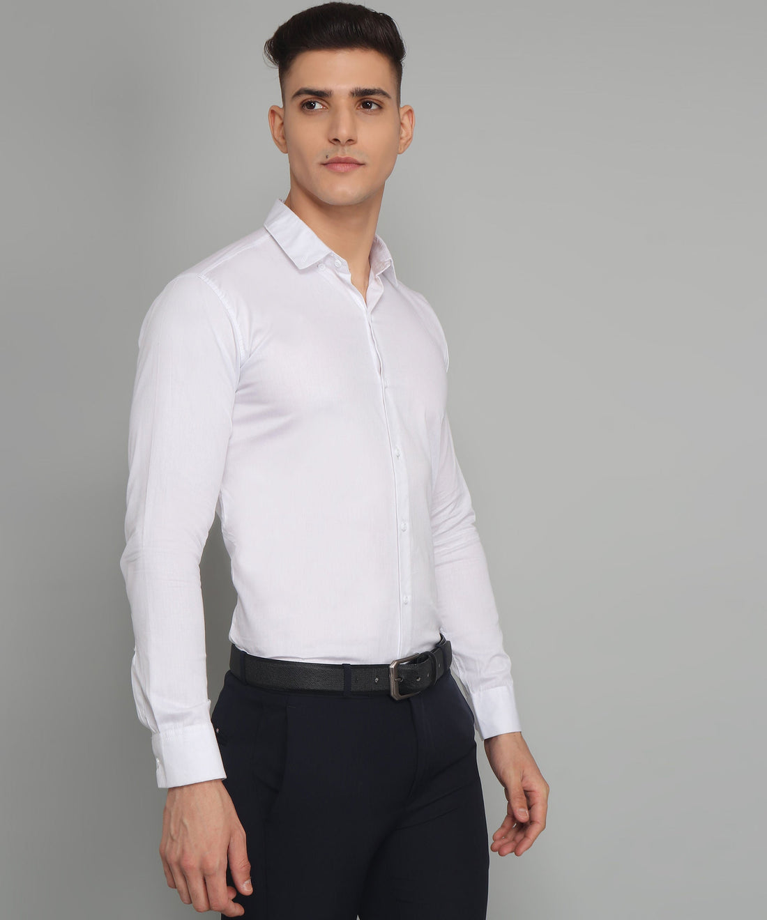 
a man wearing a white shirt and black pants
