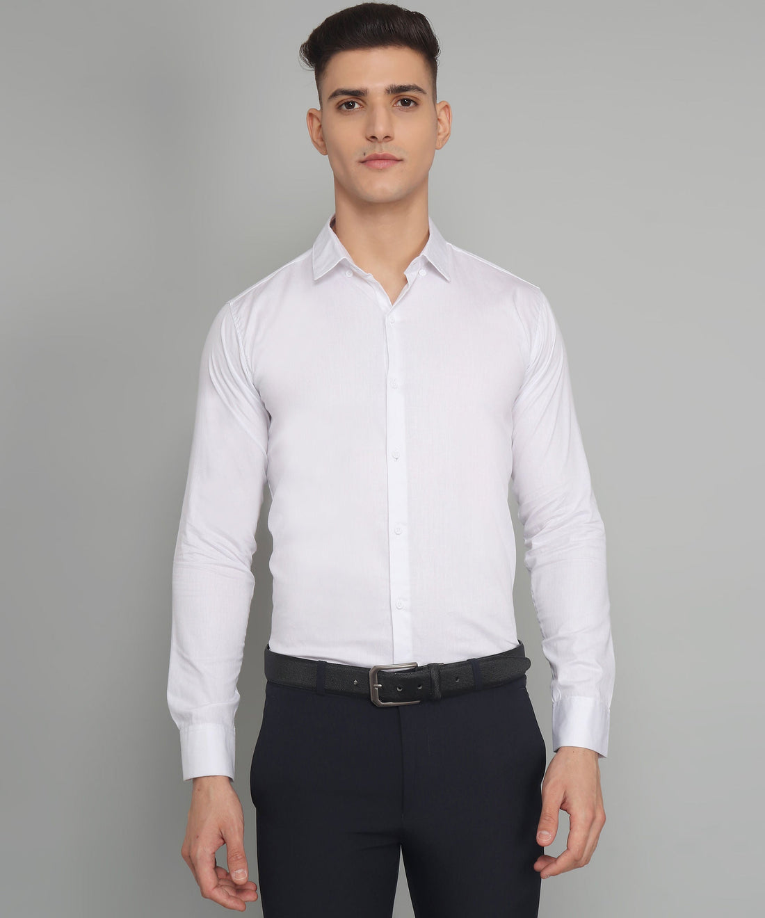 
a man in a white shirt and black pants
