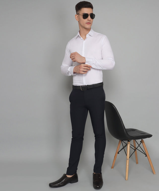 
a man in a white shirt and black pants
