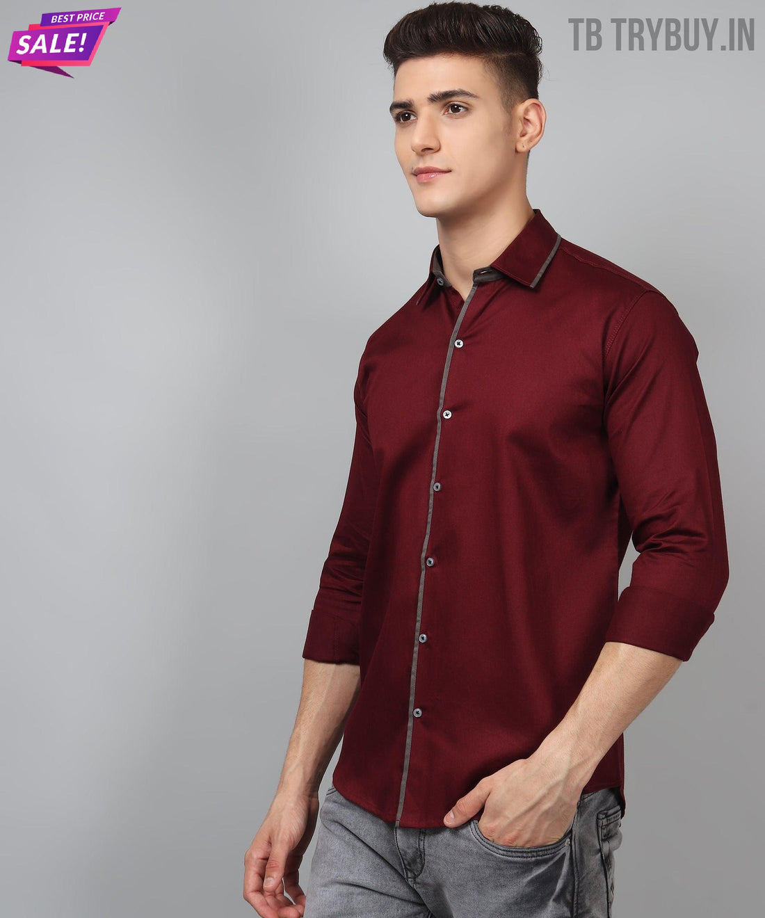 
a man wearing a red shirt and grey pants
