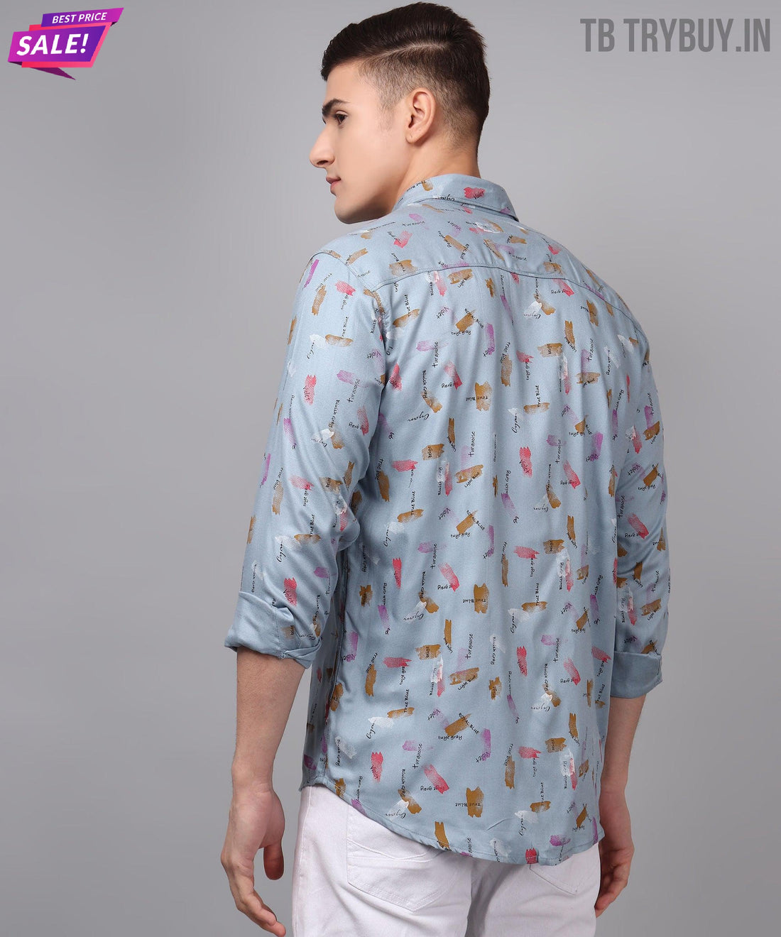 
a man wearing a blue shirt with a pattern on it
