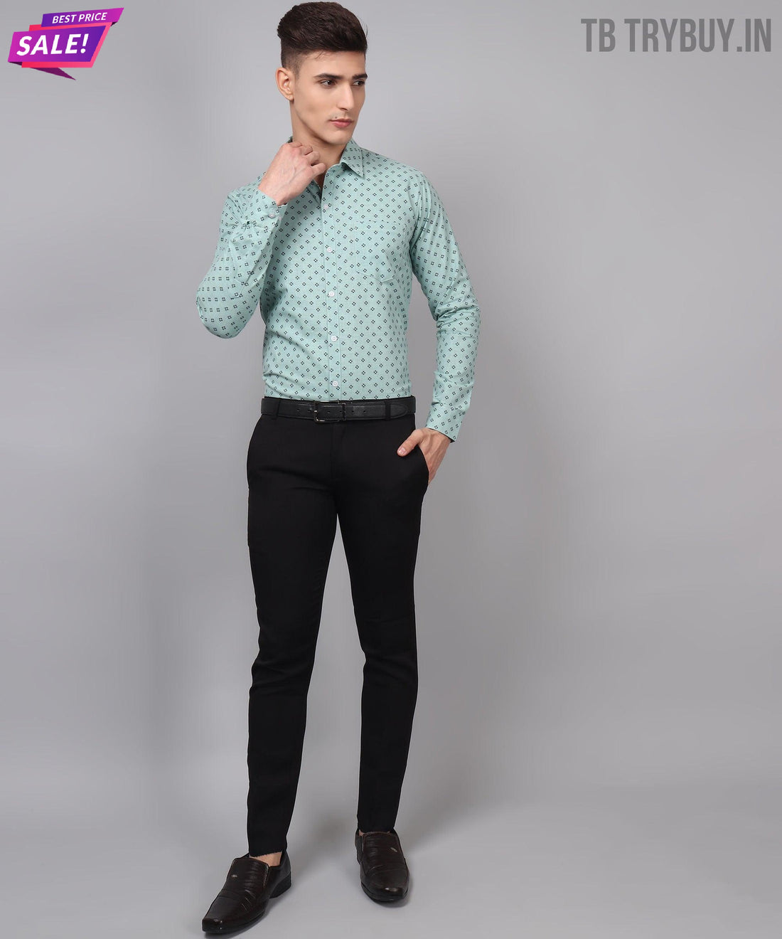 a man in a green shirt and black pants