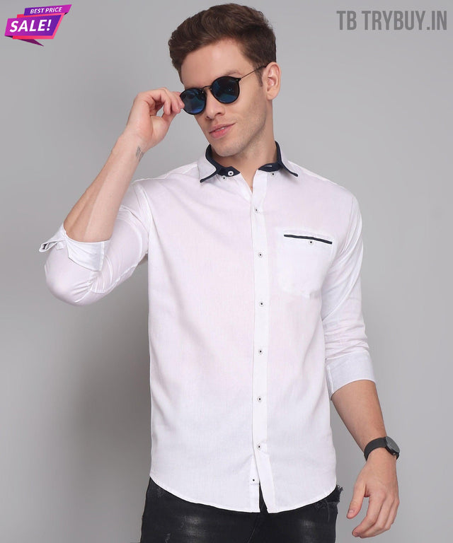 a man wearing a white shirt and black pants
