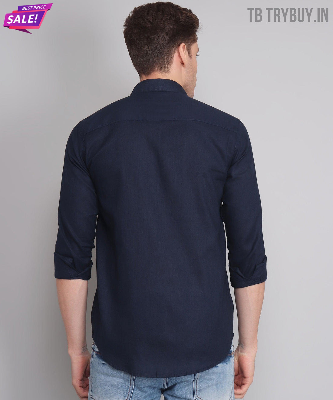 
a man wearing a dark blue shirt and jeans
