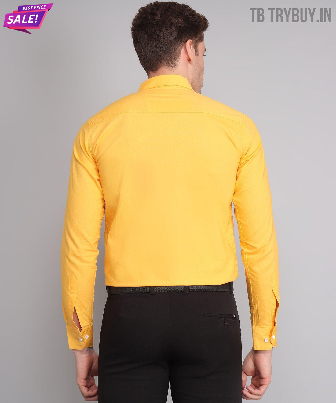 
a man wearing a yellow shirt and black pants
