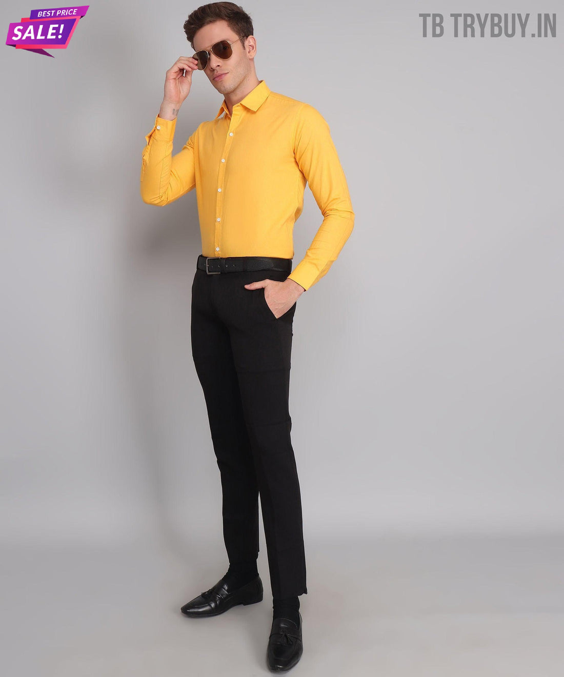 
a man in a yellow shirt and black pants
