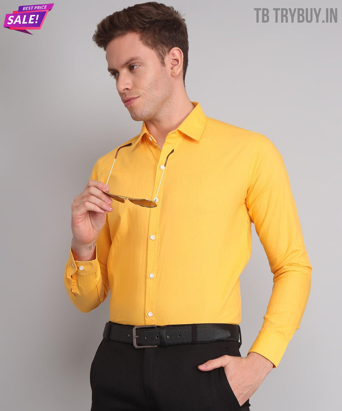 
a man wearing a yellow shirt and black pants

