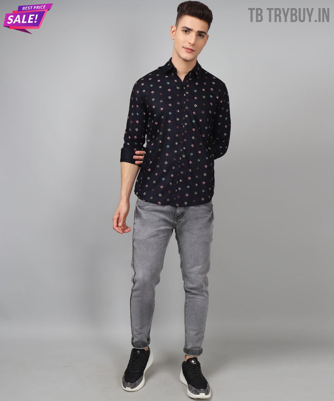 
a young man wearing a black shirt and grey pants
