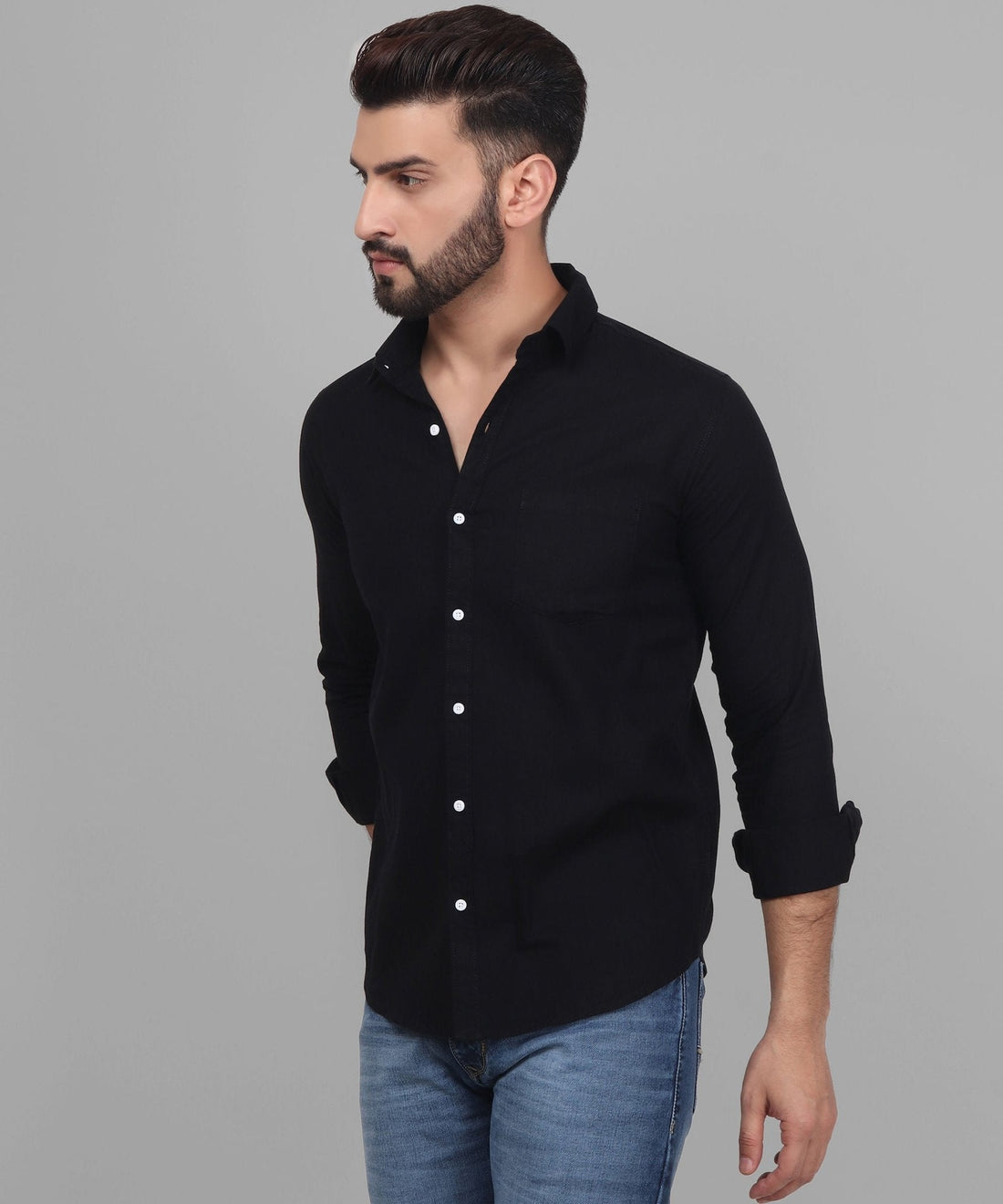 
a man wearing a black shirt and jeans
